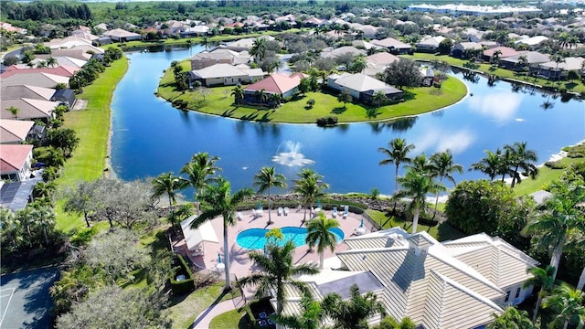 birds eye view of property featuring a residential view and a water view