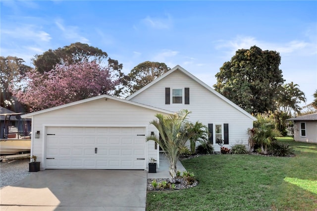 view of front of property featuring a garage and a front lawn