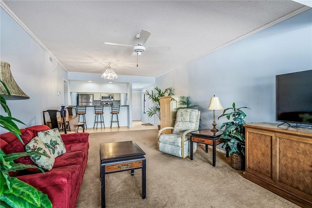 5 Plantation Dr Unit 206, Vero Beach, FL 32966 - living room with ornamental molding, carpet flooring, a ceiling fan, and a textured ceiling
