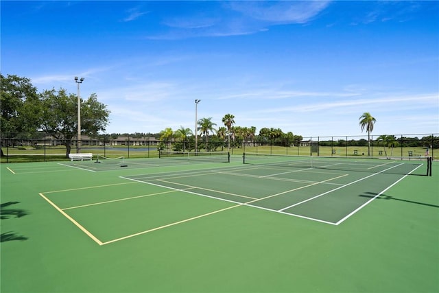 5 Plantation Dr Unit 206, Vero Beach, FL 32966 - view of tennis court with community basketball court