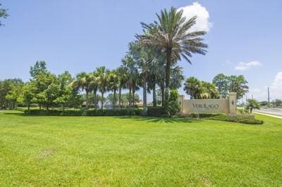 5582 49th Ave, Vero Beach, FL 32967 - surrounding community featuring a lawn