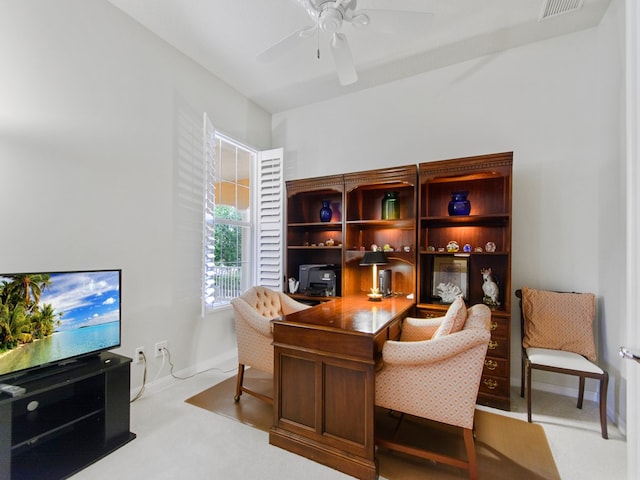 office with ceiling fan and light carpet