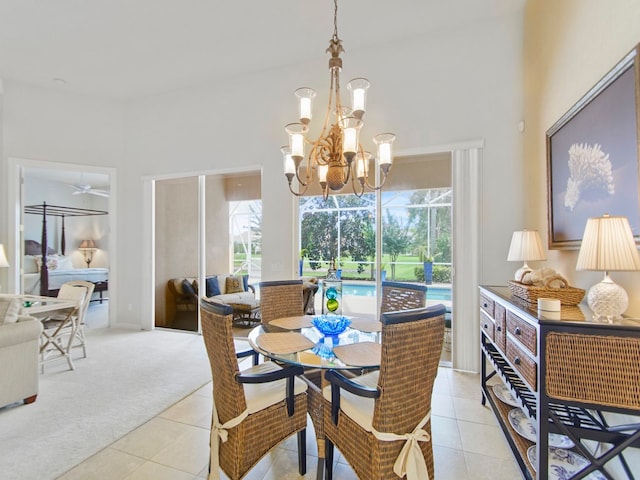 tiled dining area with a chandelier