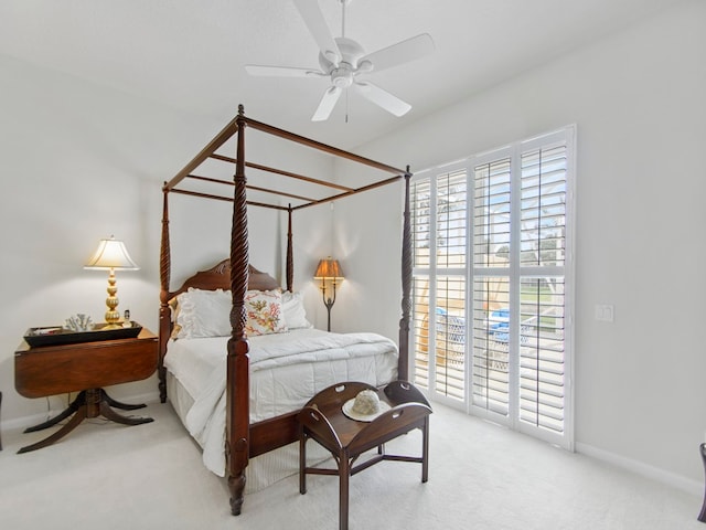 bedroom featuring light colored carpet, access to exterior, and ceiling fan