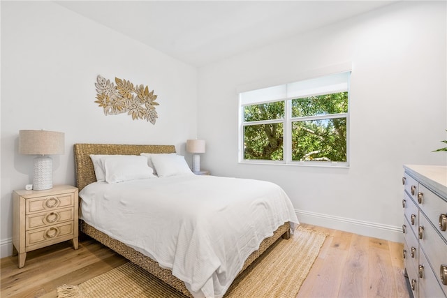 bedroom with light hardwood / wood-style floors