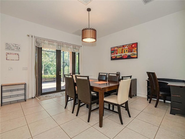 tiled dining space with french doors