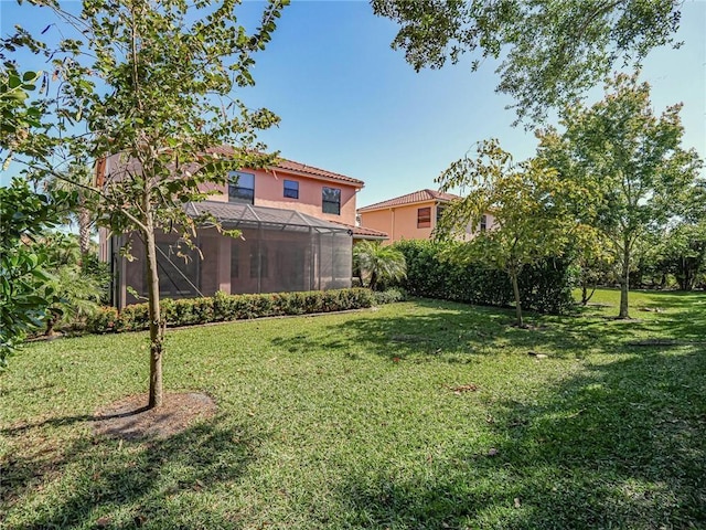 view of yard with a lanai