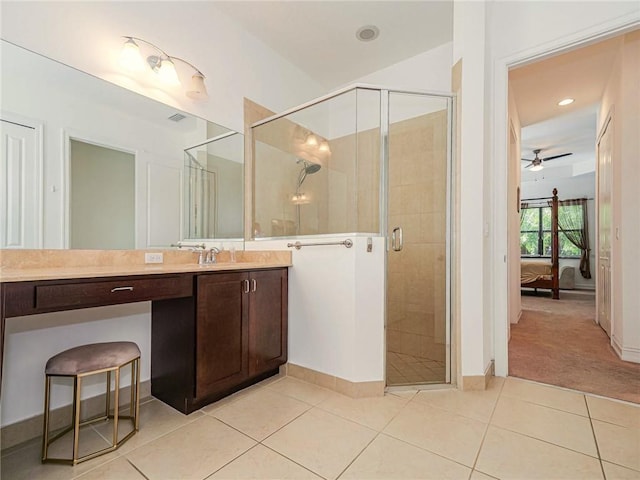 bathroom with ceiling fan, an enclosed shower, vanity, and tile patterned flooring