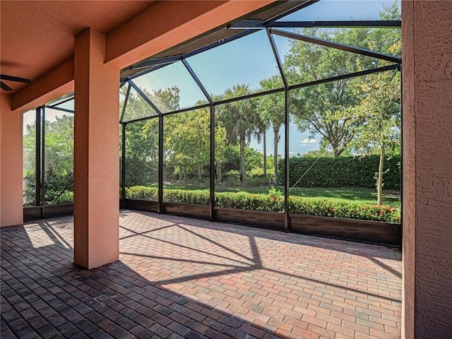 view of patio / terrace featuring a lanai and ceiling fan