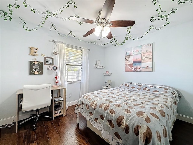 bedroom featuring a ceiling fan, baseboards, and hardwood / wood-style flooring