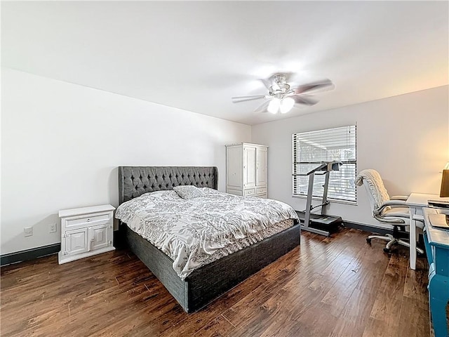 bedroom with baseboards, dark wood-type flooring, and a ceiling fan