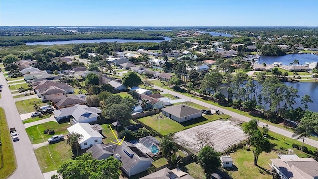 bird's eye view featuring a residential view and a water view