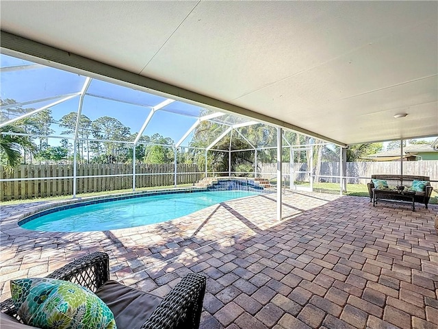 view of pool featuring a patio area, a fenced in pool, a lanai, and a fenced backyard