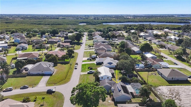 birds eye view of property featuring a residential view and a water view