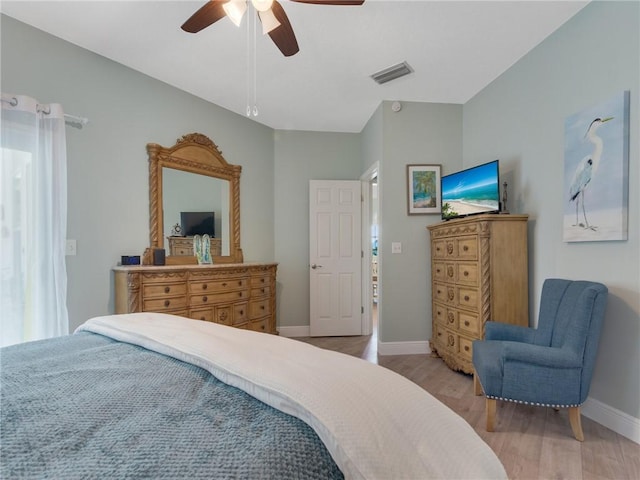 bedroom with light wood-type flooring and ceiling fan