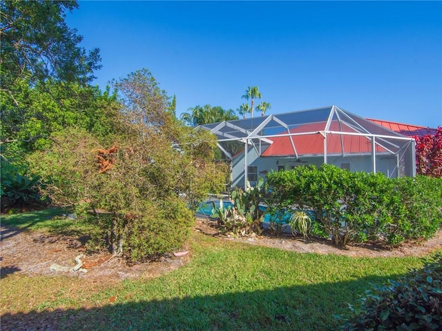 view of yard featuring a lanai