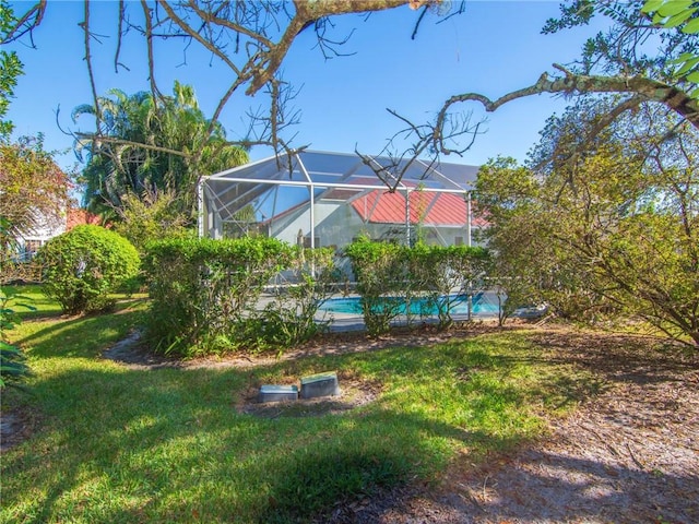 view of yard featuring glass enclosure