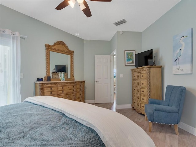 bedroom featuring ceiling fan and light hardwood / wood-style flooring