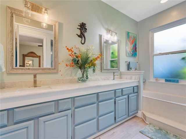 bathroom featuring a bath and vanity