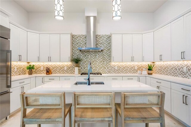 30 Strand Dr, Vero Beach, FL 32963 - kitchen with appliances with stainless steel finishes, wall chimney exhaust hood, and light countertops