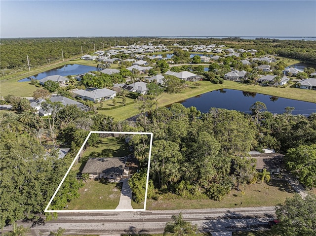 bird's eye view with a residential view and a water view