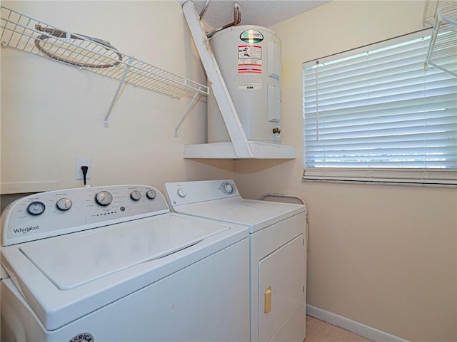 laundry room featuring baseboards, washing machine and dryer, and laundry area