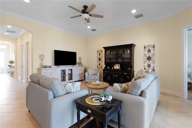 living room featuring crown molding, ceiling fan, and light tile patterned flooring