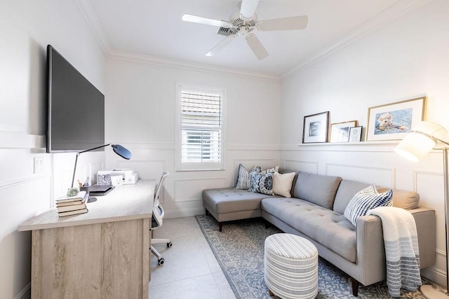 office area with light tile patterned floors, a ceiling fan, crown molding, and a decorative wall