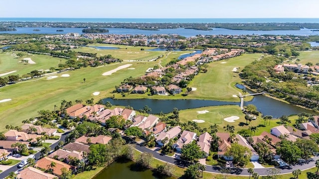 birds eye view of property featuring a residential view, golf course view, and a water view