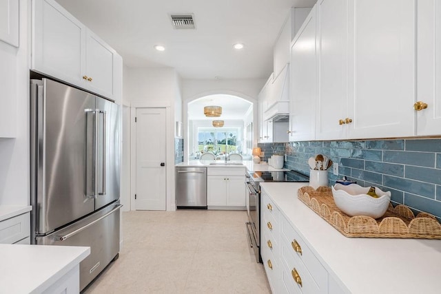 kitchen featuring light countertops, visible vents, appliances with stainless steel finishes, and a sink