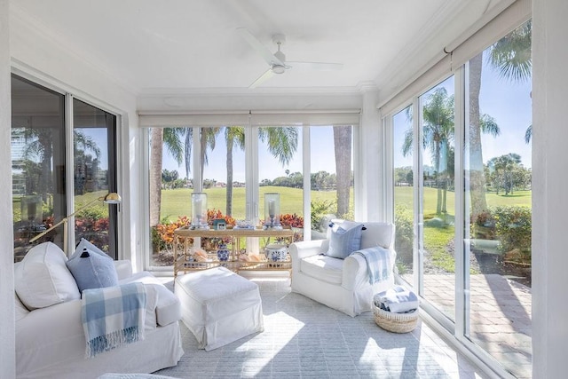 sunroom with a wealth of natural light and ceiling fan