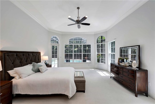 carpeted bedroom with crown molding and ceiling fan