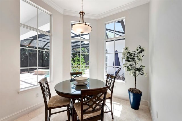 dining space with ornamental molding