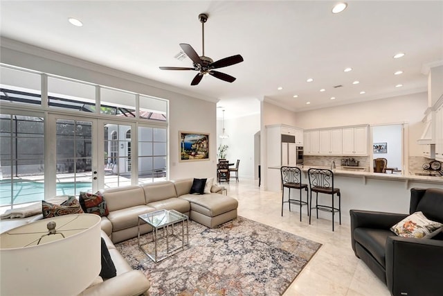 living room featuring ornamental molding, ceiling fan, and french doors