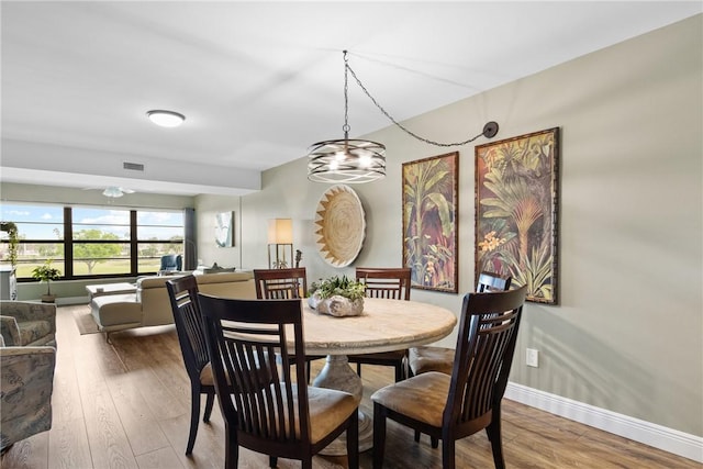 31 Plantation Dr Unit 205, Vero Beach, FL 32966 - dining space featuring wood finished floors and baseboards
