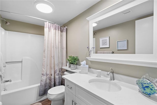 31 Plantation Dr Unit 205, Vero Beach, FL 32966 - bathroom with vanity, shower / bath combination with curtain, and wood finished floors
