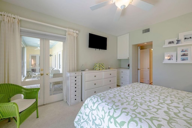 bedroom featuring ceiling fan, french doors, visible vents, light colored carpet, and access to outside