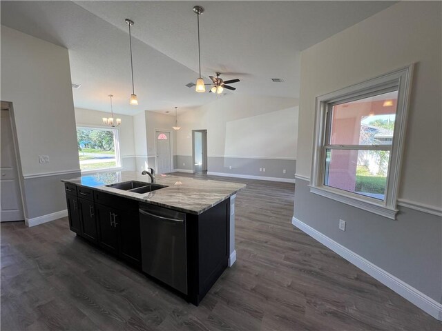 kitchen featuring dishwasher, an island with sink, dark wood-type flooring, sink, and lofted ceiling