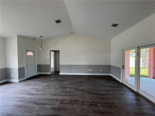 unfurnished living room with lofted ceiling and dark hardwood / wood-style floors