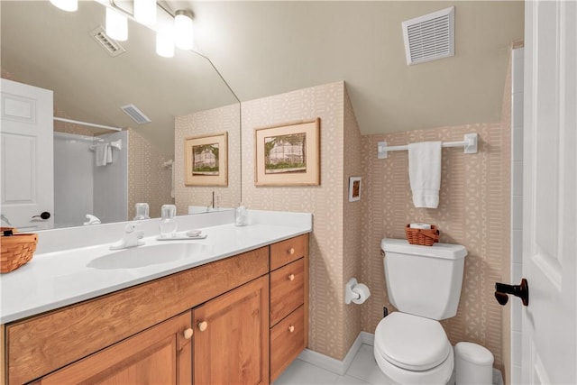 bathroom featuring tile patterned floors, a shower, vaulted ceiling, toilet, and vanity