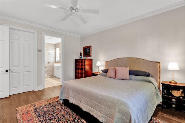 bedroom with light wood-type flooring, ensuite bath, ceiling fan, and ornamental molding