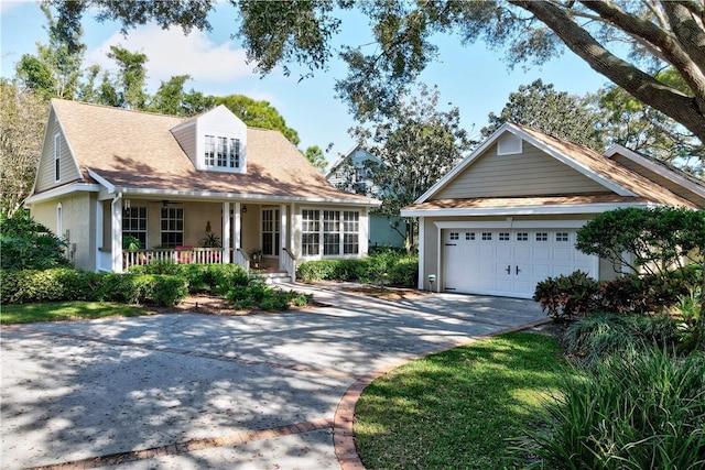 view of front facade with covered porch and a garage