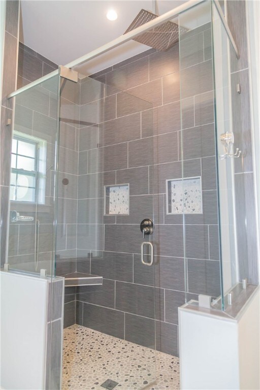 bathroom featuring an enclosed shower