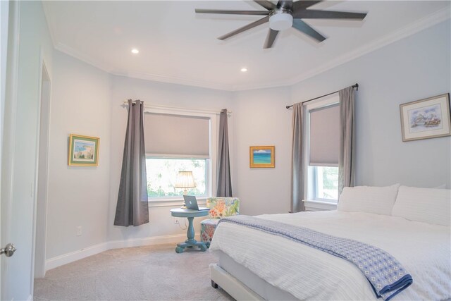 carpeted bedroom with ornamental molding, multiple windows, and ceiling fan