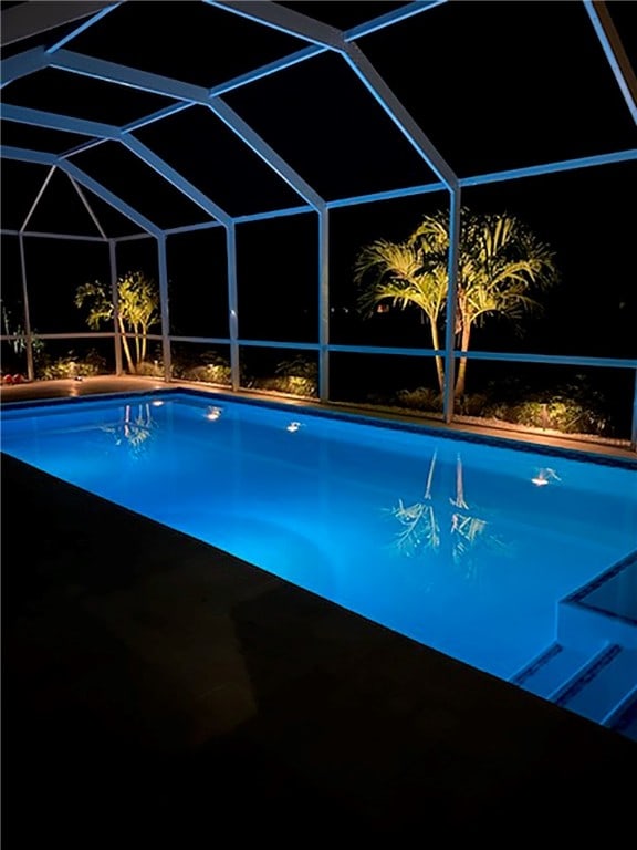 view of pool with a lanai