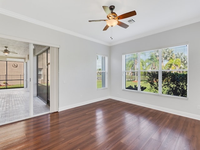 spare room featuring ornamental molding, dark hardwood / wood-style floors, and ceiling fan