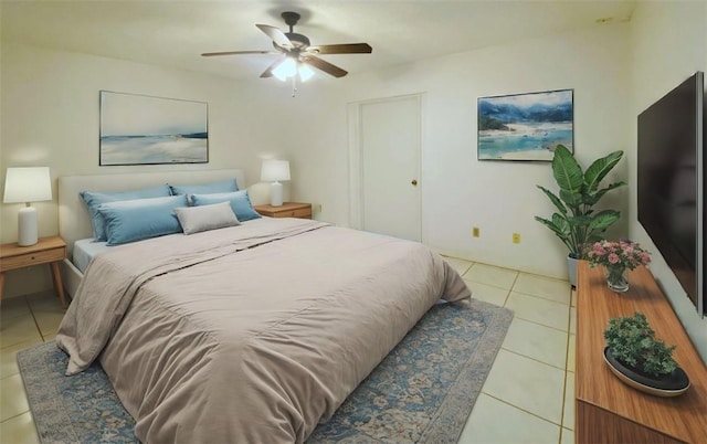 tiled bedroom featuring ceiling fan