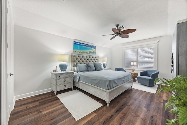 bedroom with ceiling fan and dark wood-type flooring