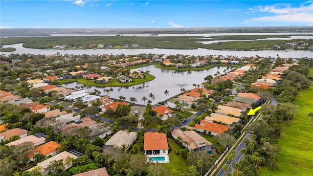 drone / aerial view featuring a water view