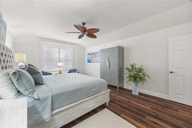 bedroom with ceiling fan, dark hardwood / wood-style floors, and lofted ceiling